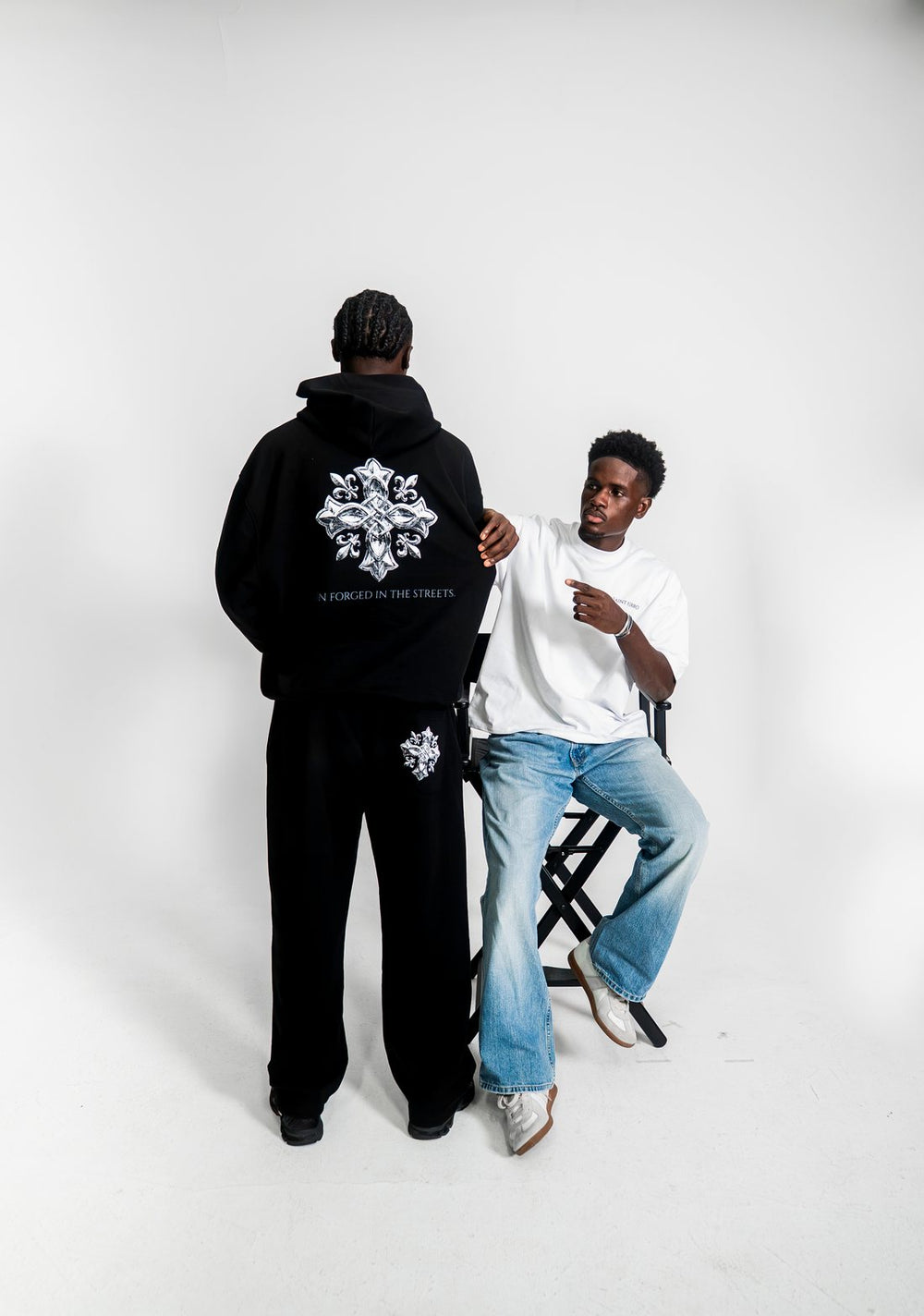 The Forge Hoodie back print next to The Forge Tee in Marshmallow White